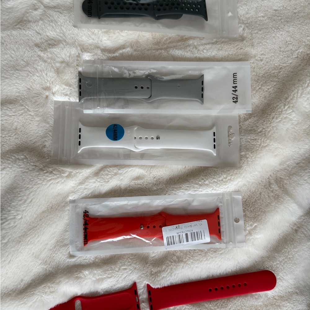 Apple Watch Bands in Black, Gray, White, and Red